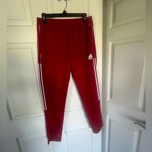 Men’s size M red with white stripes adidas track pants.